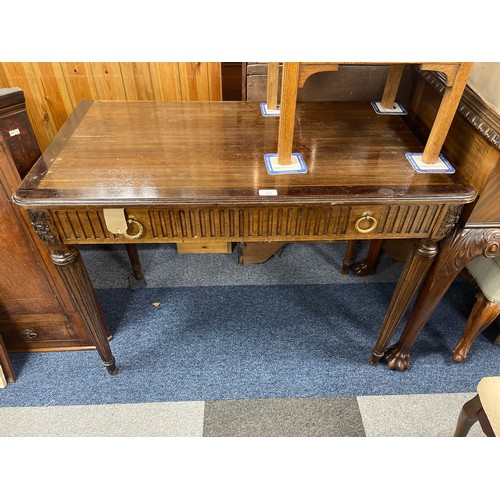 347 - A mahogany side table, with frieze drawer and tapering legs -