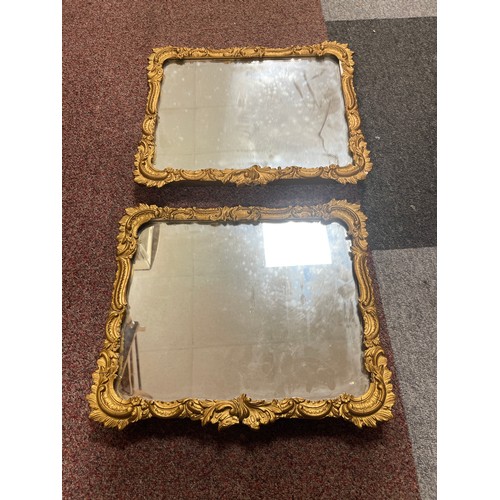 320A - A pair of gilt framed wall mirrors -