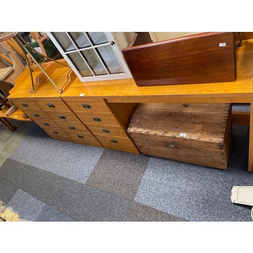 343 - A pine dressing table, together with a matching pair of four drawer bedside chests -