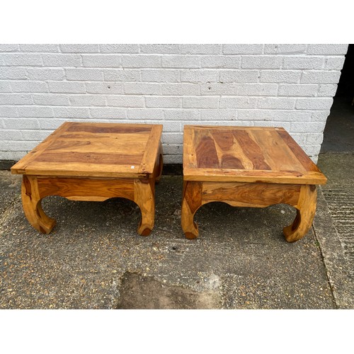 345 - A pair of modern hardwood occasional tables, each low table with square top -