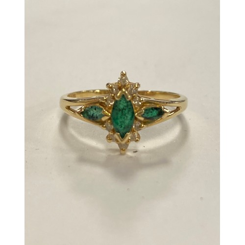 16 - A diamond and emerald ring, with a marquise shaped emerald in diamond surround, to emerald set shoul... 