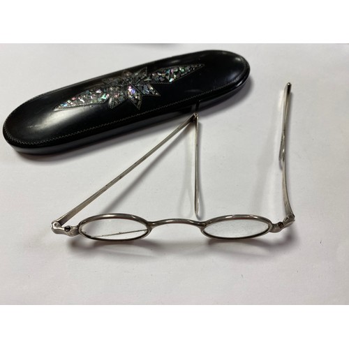 259 - A Victorian papier mache shell inlaid spectacles case and a pair of spectacles -