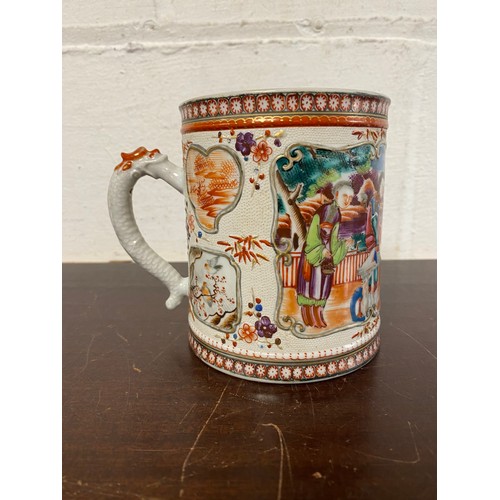 117 - A Chinese export mug, enamelled in the famille rose palette with figures -