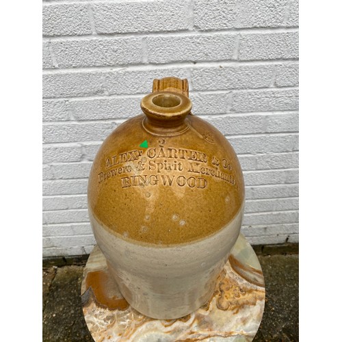 121 - An early 20th century stoneware flagon, impressed for Alex Carter & Co, Ringwood -