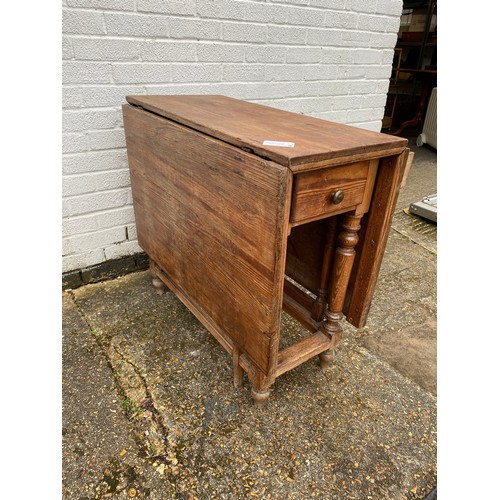 353 - A French pitch pine gateleg table, with end drawer -