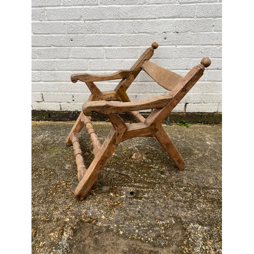 363 - A late 19th century carved saddle chair, together with a heavy horse harness -