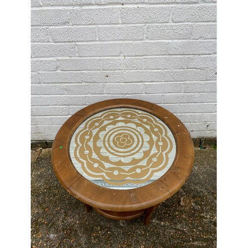 364 - An early 20th century walnut finish circular two tier table, inset with mirrored glass top -