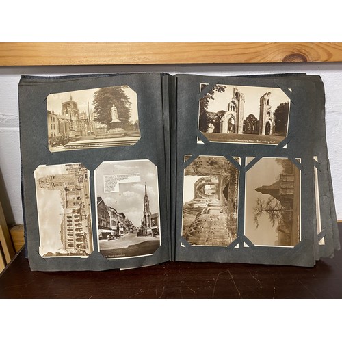 290 - Postcards: two albums, the first album of approximately 220 vintage postcards, mostly sepia titled t... 