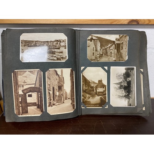 290 - Postcards: two albums, the first album of approximately 220 vintage postcards, mostly sepia titled t... 