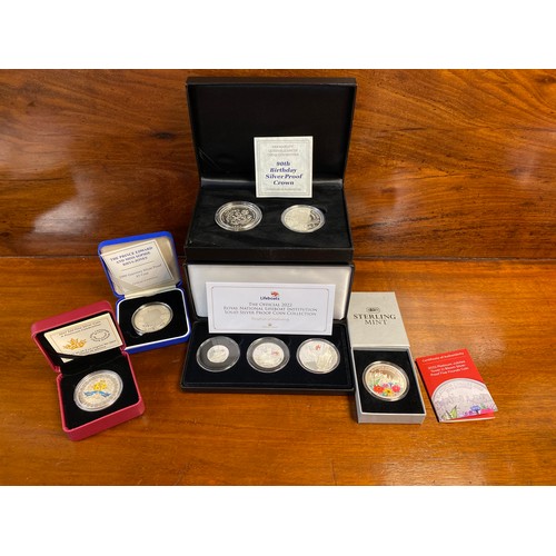 86 - A 2022 RNLI silver proof three coin collection set, together with Queen Mother 90th and 100th birthd... 