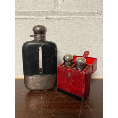 47 - A George V silver mounted flask, Sheffield 1919, together with a cased pair of bottles -