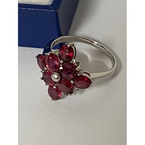 56 - A 9ct white gold ring, set with a garnet cluster -