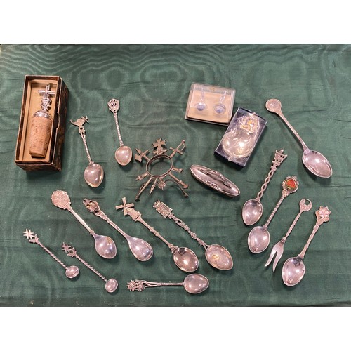 64 - A small quantity of white metal plated spoons, nail buffer, plated caddy spoon etc -