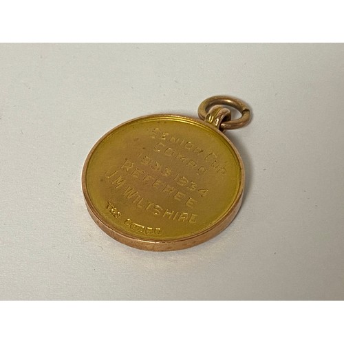 103 - A 9ct gold and enamel Gloucestershire Football Association medal, awarded to a referee, 1934 -