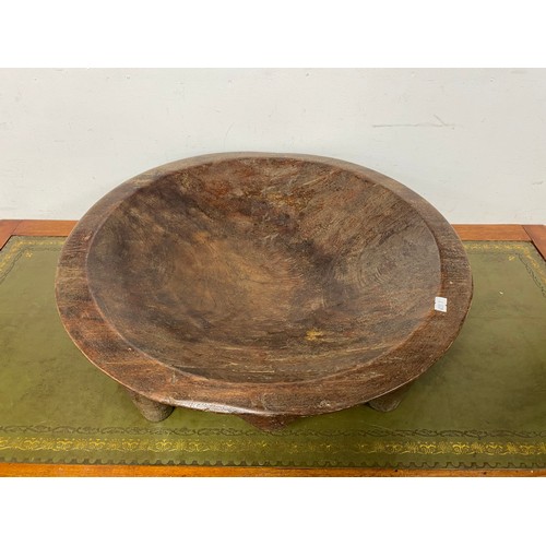 321 - An Oceanic kava bowl, raised on four legs -