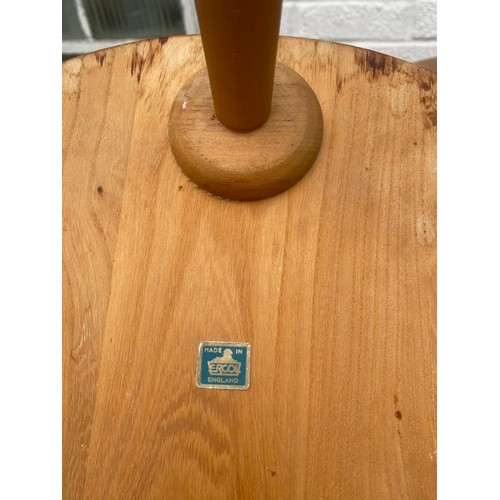 420 - A nest of three Ercol 'Pebble' tables, labelled -