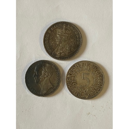 76A - A 1915 Indian one rupee, together with a Dutch 1848 1 Gulden and a German 1965 5 marks (3) -