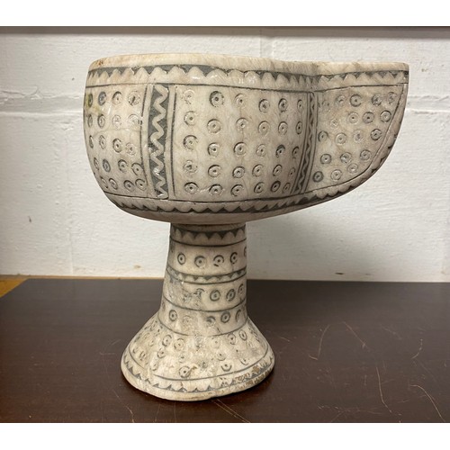 197 - A carved and stained vessel -