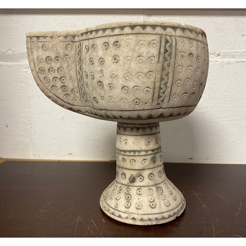 197 - A carved and stained vessel -