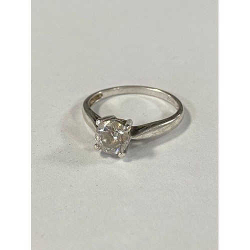 16 - A CZ set solitaire ring, mounted in silver -