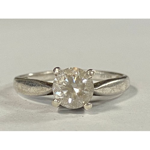 16 - A CZ set solitaire ring, mounted in silver -