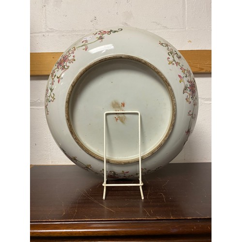 105 - A large Chinese yellow ground plate, with banded figural decoration -