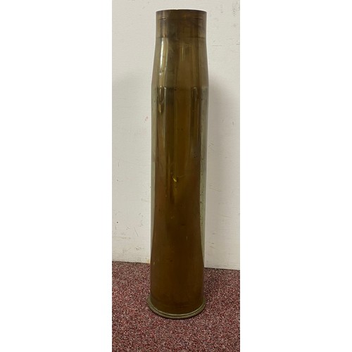 226 - Militaria: A large shell case,
another and a military box -
