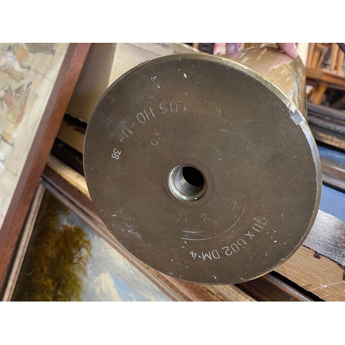 226 - Militaria: A large shell case,
another and a military box -