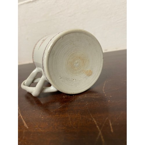112 - A Chinese export mug, enamelled with floral decoration, with entwined handle -