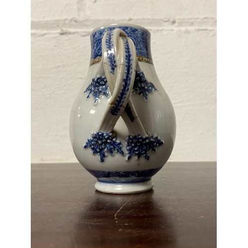 113 - A Chinese export armorial sparrowbead jug, enamelled with swagged and initalled arms and floral deco... 