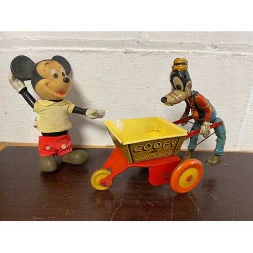 246 - Toys: a Marx tin plate Goofy the Gardener toy, together with a vintage Mickey Mouse (2) -