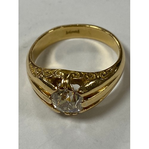 42 - A gent's diamond single stone ring, set with an old cut diamond to reeded shoulder, in 18ct gold mou... 