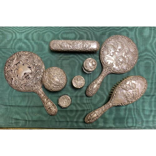 52 - A group of silver backed mirrors and brushes, and silver covered pot -