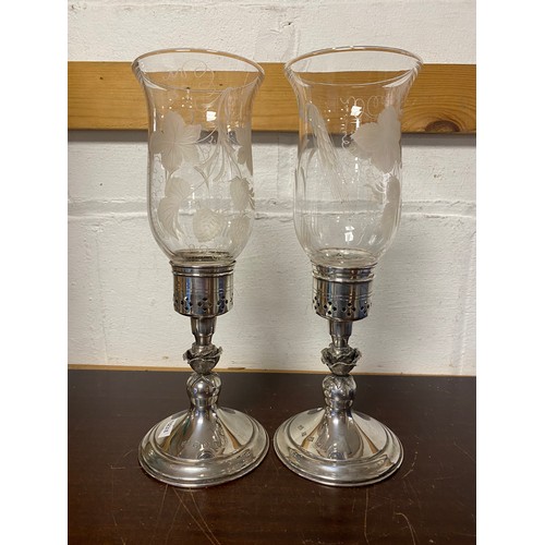 64 - A pair of modern silver storm candlesticks, Mappin & Webb, Birmingham 1973/74, with etched glass sha... 