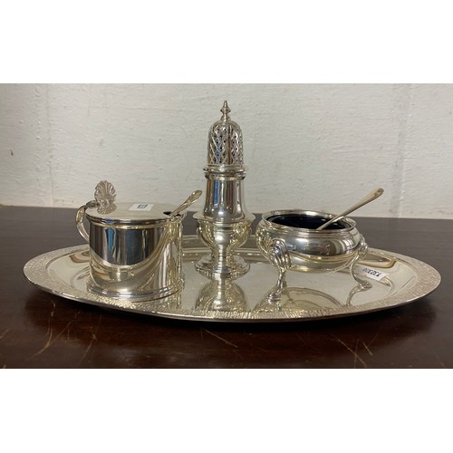 66 - A modern silver cruet, Mappin & Webb, various dates, the three piece set, with spoon on matching ova... 