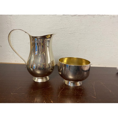 74 - A modern silver jug, London 1979, with gilt interior and matching bowl -