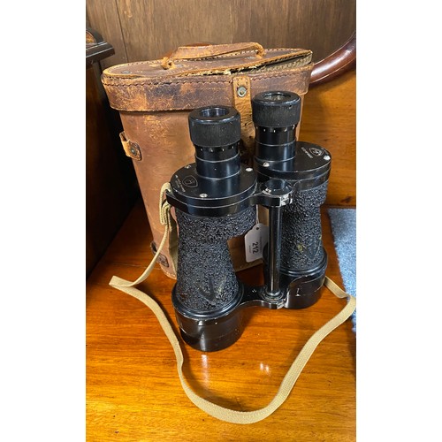 212 - A pair of WW2 military issue binoculars, cased -