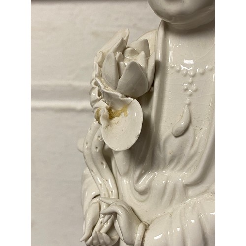 81 - A Chinese blanc de chine model of Guanyin, on lotus base -