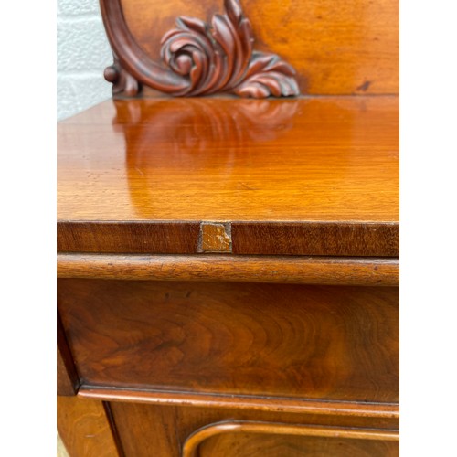 246 - A Victorian mahogany chiffonier, with raised 'C' scroll and leaf back, over frieze drawer and cupboa... 