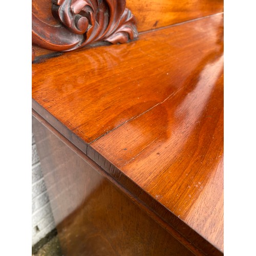 246 - A Victorian mahogany chiffonier, with raised 'C' scroll and leaf back, over frieze drawer and cupboa... 