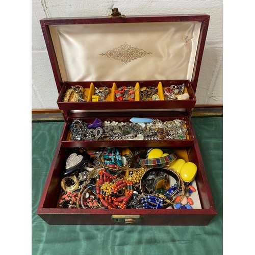 24 - A jewellery box containing a quantity of costume jewellery -