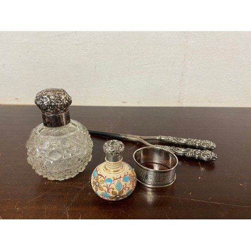 38 - A small group of silver items, various dates and makers, comprising two silver mounted scent bottles... 