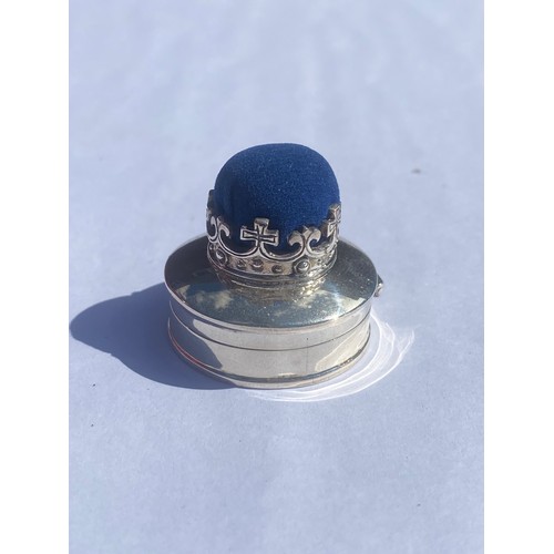 48 - A modern silver combination pill box/pin cushion, the cover surmounted by a crown -