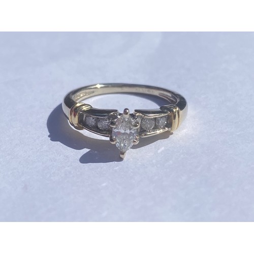 49 - A modern diamond ring, set with a marquise cut diamond within diamond set shoulders, in 14ct gold mo... 