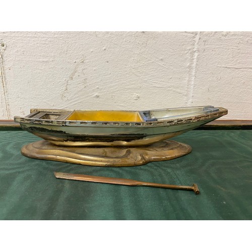 78 - An early 20th century plated smokers stand, designed as a boat -