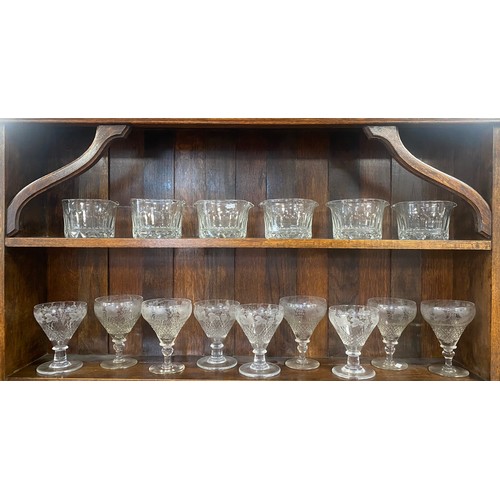 99 - A set of nine French wine glasses, each engraved with fruiting vines, together with six cut glass ri... 