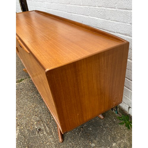 251 - Val Rossi for Beithcraft: a mid century teak sideboard fitted with three drawers and two cupboard do... 