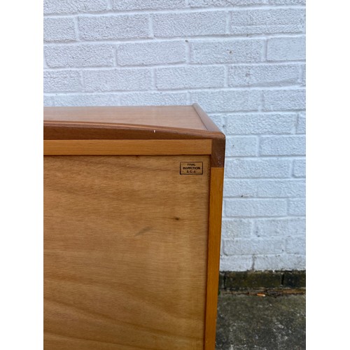 251 - Val Rossi for Beithcraft: a mid century teak sideboard fitted with three drawers and two cupboard do... 