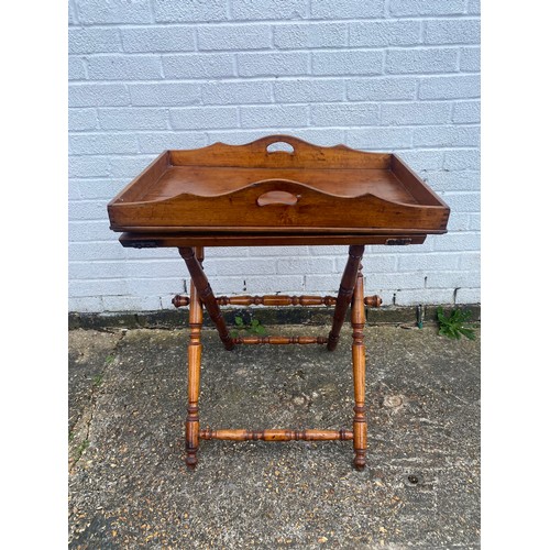 294 - An Edwardian walnut butlers tray, on folding stand -