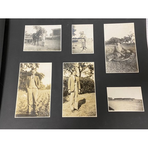 227 - An early 20th century photograph album, including military and travel photographs -